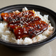 Sweet and smoky sardines over rice